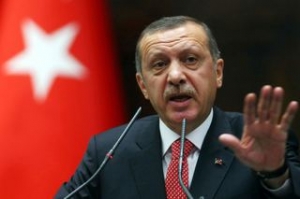 Recep Erdogan o acuză pe Angela Merkel că susţine
